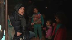CNN's Arwa Damon at a makeshift camp for displaced families in northwest Syria.