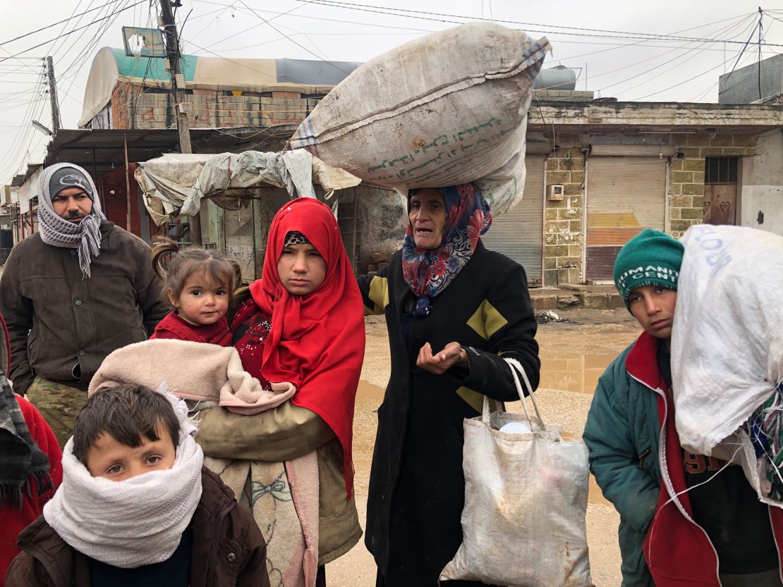 This family has been walking in freezing cold conditions for 7 hours. They fled their home in the middle of the night, packing some clothes into old flour bags
