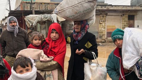 This family has been walking in freezing cold conditions for 7 hours. They fled their home in the middle of the night, packing some clothes into old flour bags