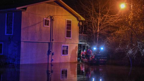 Emergency personnel rescued Janis Hart Landrum from her home as water from the Pearl River rose Saturday night. 