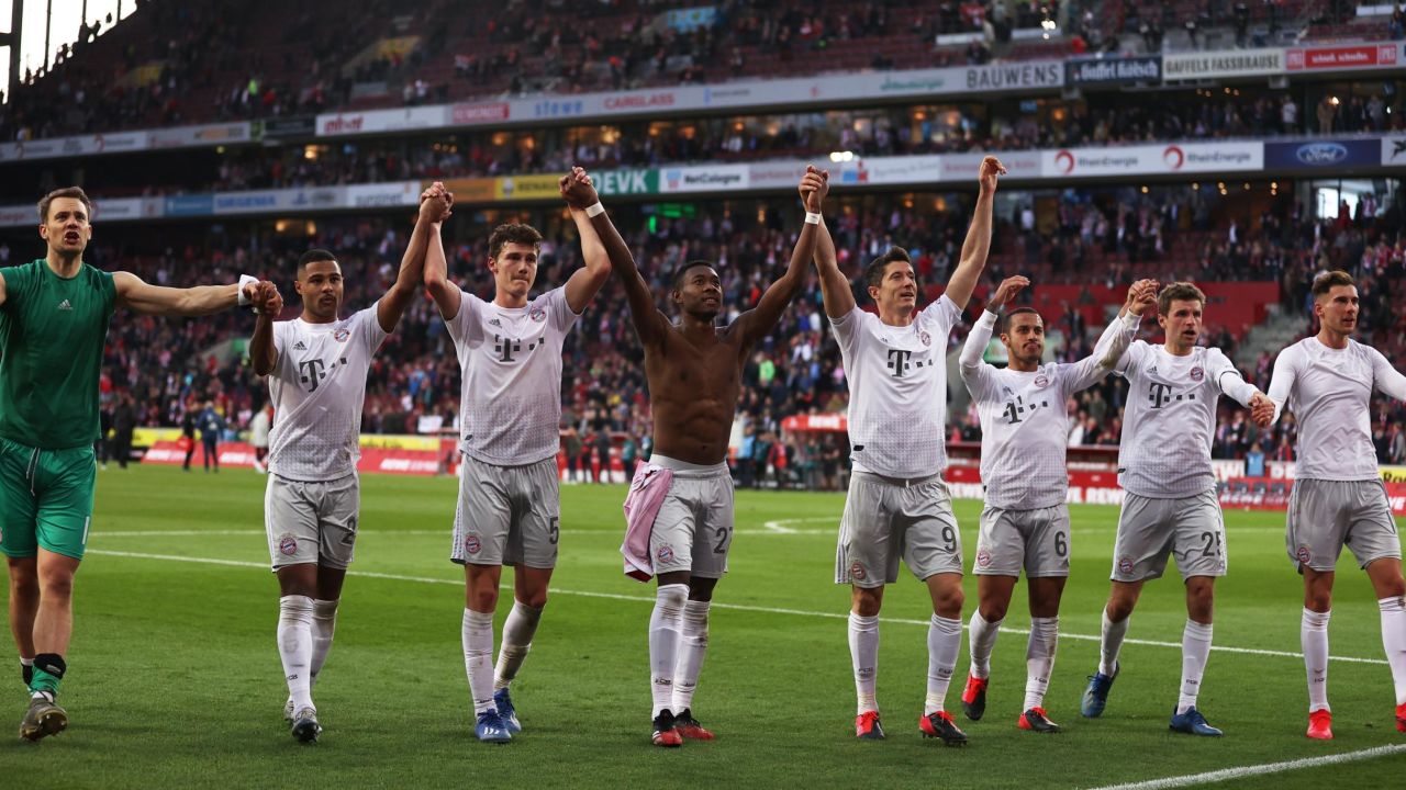Bayern players celebrate at the final whistle. 