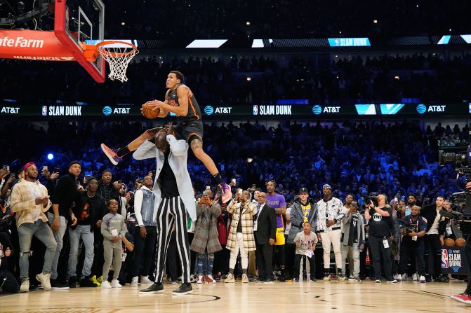 Aaron Gordon dunks over Boston Celtics center Tacko Fall during the NBA Slam Dunk Contest on Saturday, February 15 in Chicago. Despite successfully jumping over the 7 foot 5 inch tall Fall, Gordon <a href="index.php?page=&url=https%3A%2F%2Fwww.cnn.com%2F2020%2F02%2F16%2Fus%2Fnba-all-star-slam-dunk-contest-trnd%2Findex.html" target="_blank">lost the contest </a>by one point to Derrick Jones Jr. sparking controversy over the result.