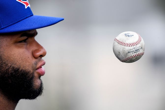 Toronto Blue Jays pitcher Yennsy Diaz juggles a baseball during spring training workouts in Dunedin, Florida, on February 13.