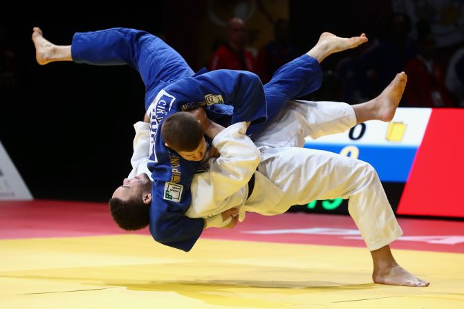 Simeon Catharina of Netheralnds (white) and Miklos Cirjenics of Hungary (blue) compete at the Paris Grand Slam judo tournament in Paris on February 9.