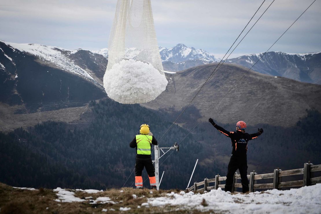 The helicopter brought snow to the ski slope near the Superbagneres station in French Pyrenees.
