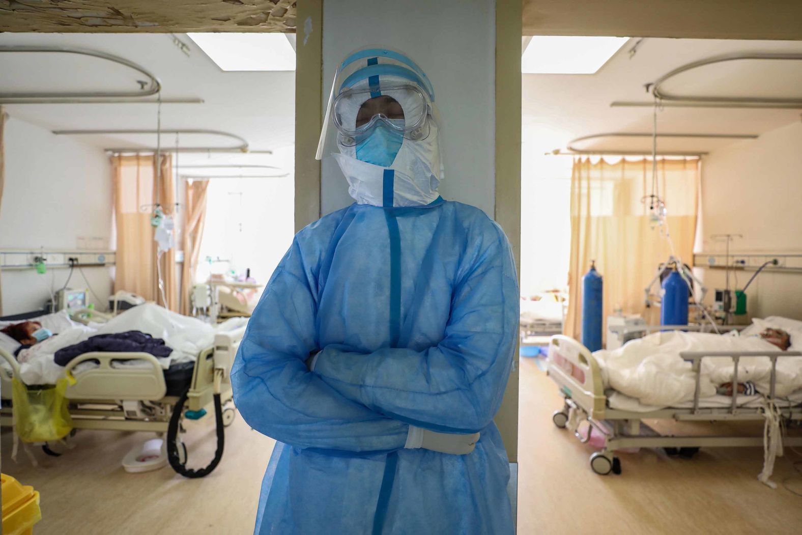 A medical worker rests at the isolation ward of the Red Cross hospital in Wuhan on February 16, 2020.