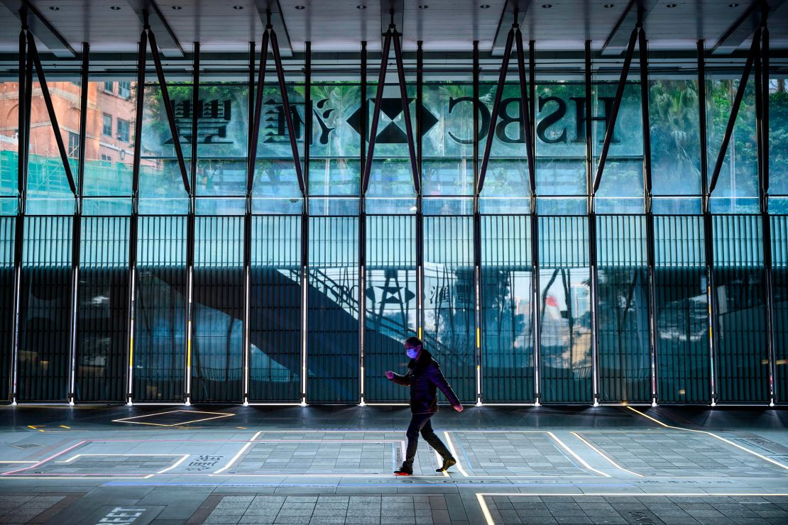 A man wearing a face mask walking past the shuttered HSBC building in Hong Kong in January. HSBC is dealing with with a growing list of negative headwinds, including protests in Hong Kong and the coronavirus outbreak.