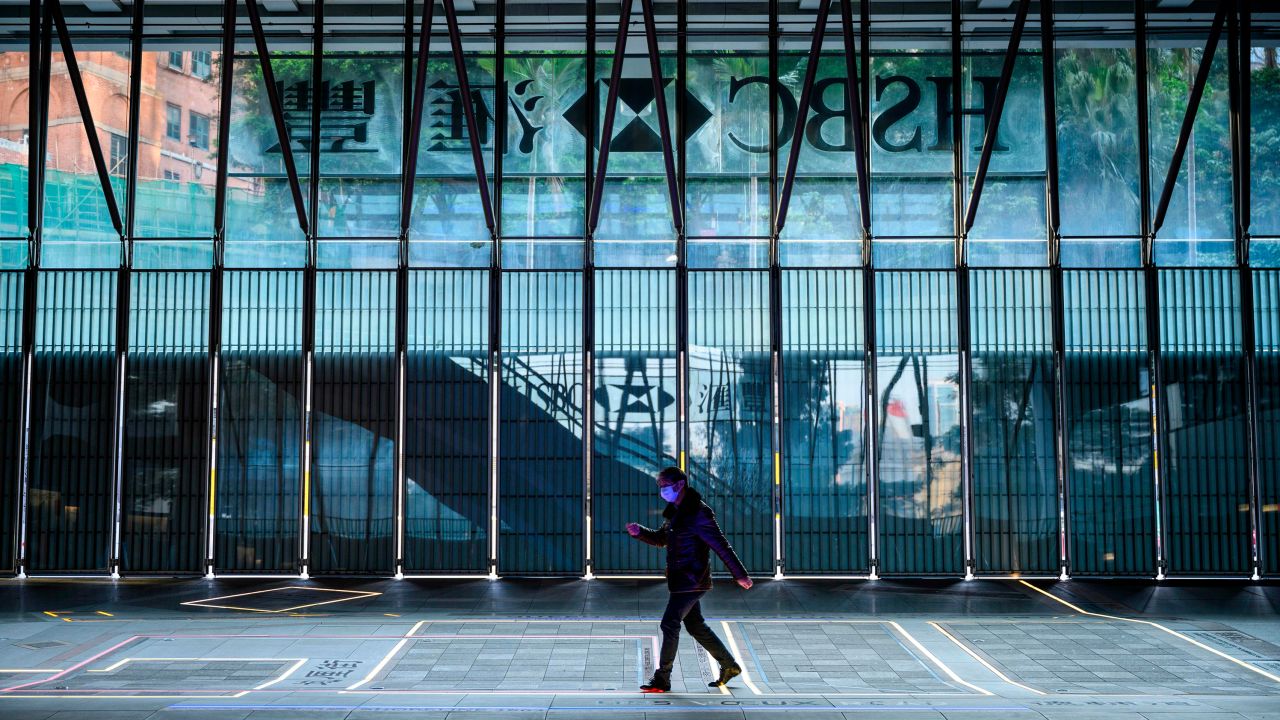 A man wearing a face mask walking past the shuttered HSBC building in Hong Kong in January. HSBC is dealing with with a growing list of negative headwinds, including protests in Hong Kong and the coronavirus outbreak.