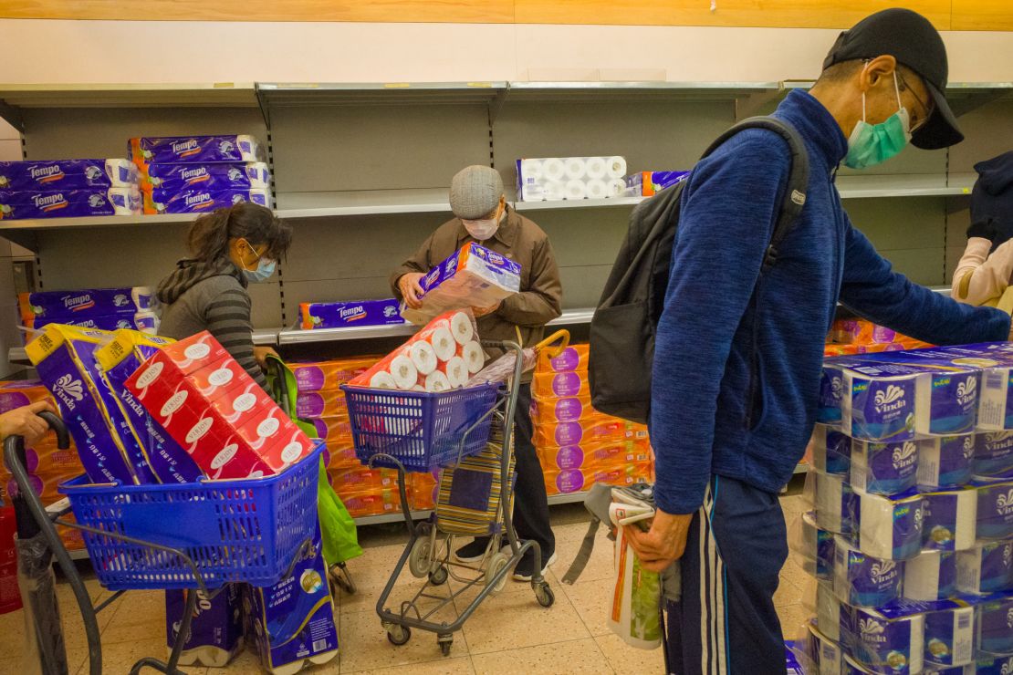 Shoppers buying toilet rolls in a supermarket on February 11, 2020 in Hong Kong.