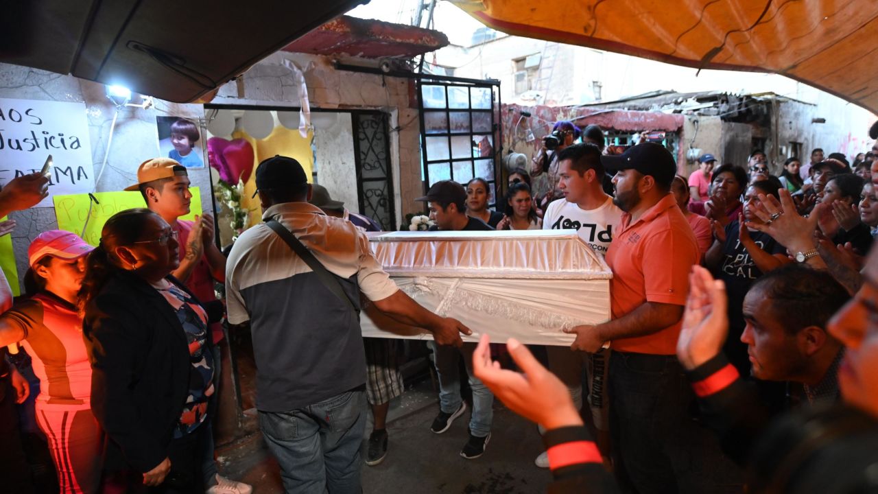 People carry the coffin during the funeral of seven-year-old Fátima, whose body was found over the weekend.