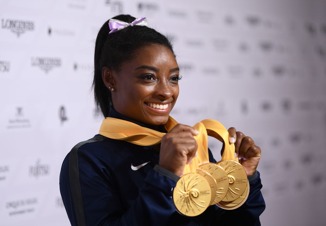 Simone Biles shows off her medal haul at the world championships.
