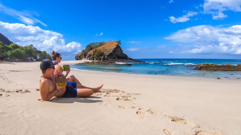 underscored couple on sunny beach