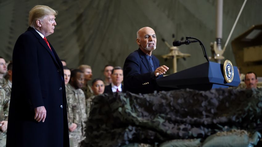 Afghan President Ashraf Ghani speaks to US soldiers as President Donald Trump listens during a surprise Thanksgiving day visit at Bagram Air Field, on November 28, 2019 in Afghanistan. (Photo by Olivier Douliery / AFP) (Photo by OLIVIER DOULIERY/AFP via Getty Images)