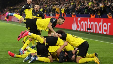 Erling Braut Haaland is mobbed after scoring the winner.