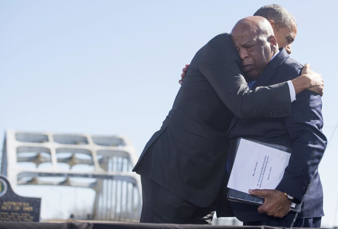 President Barack Obama hugs John Lewis during an event marking the 50th Anniversary of the Selma to Montgomery civil rights marches at the Edmund Pettus Bridge in Selma, Alabama, on March 7, 2015.