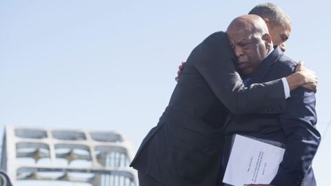 President Barack Obama hugs John Lewis during an event marking the 50th Anniversary of the Selma to Montgomery civil rights marches at the Edmund Pettus Bridge in Selma, Alabama, on March 7, 2015.