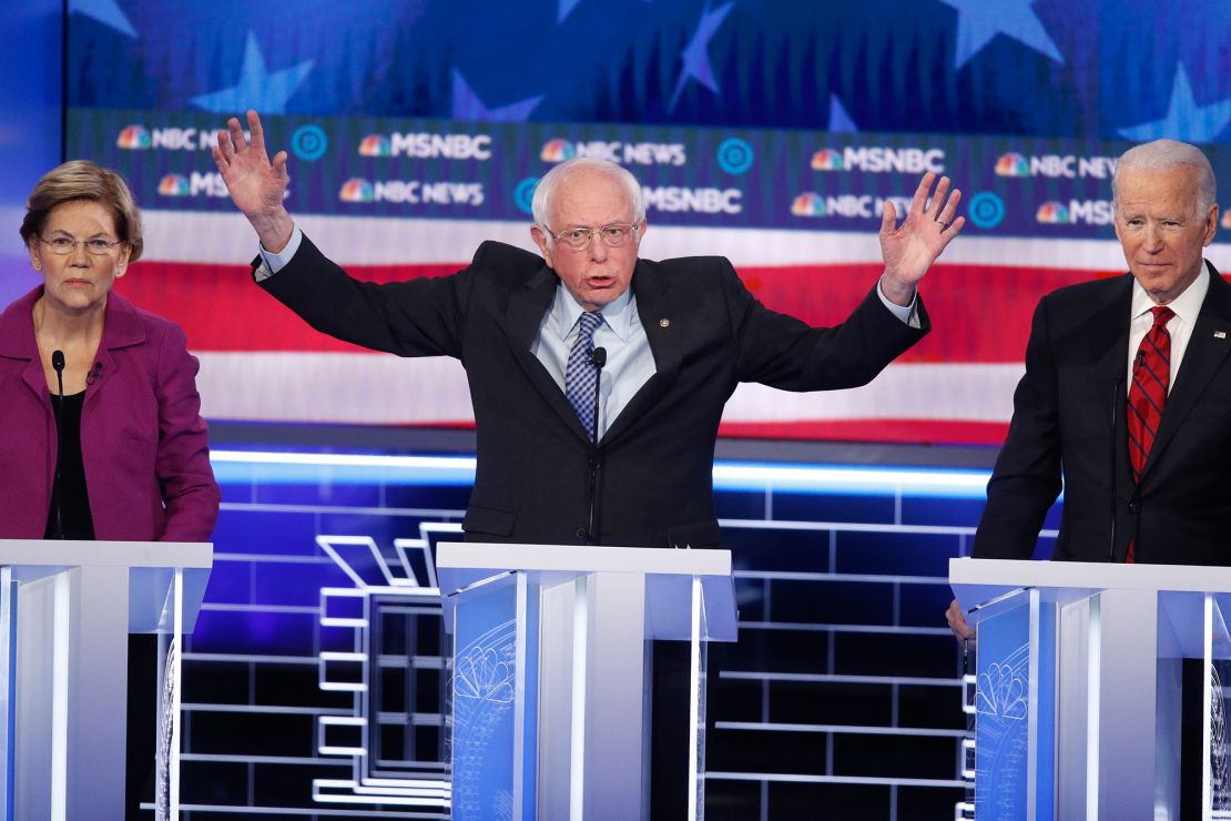 Sanders speaks between Warren and Biden during the Democratic presidential primary debate.