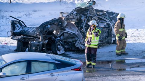 Emergency personnel gather at the scene following a multi-vehicle crash on the south shore of Montreal in La Prairie, Quebec, on Wednesday, February 19, 2020. 