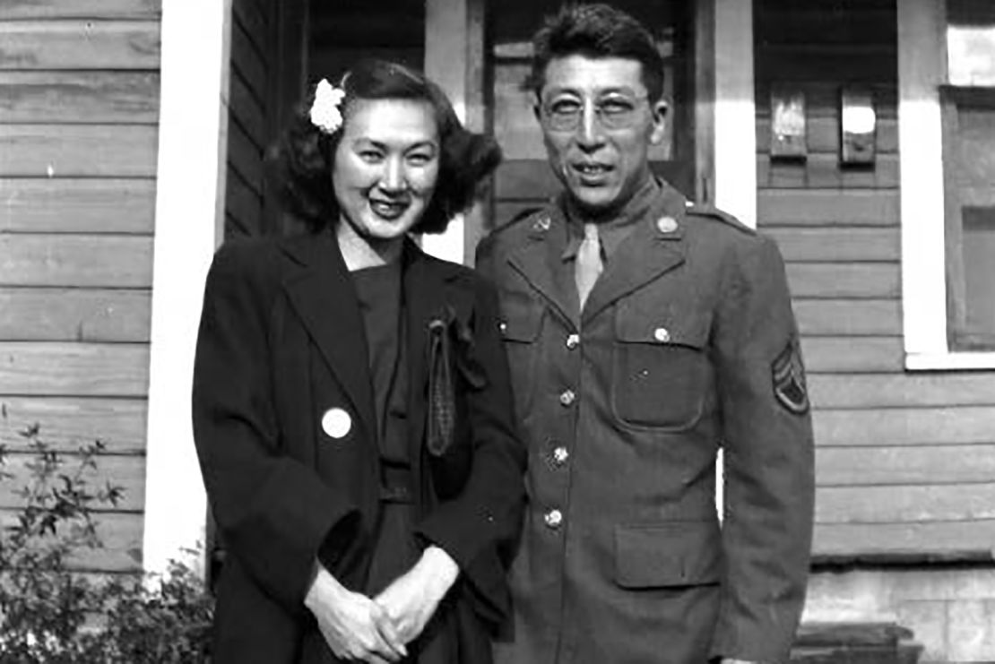 Bette and Kuichi Takei in front of their military housing in Hattiesburg, Mississippi.