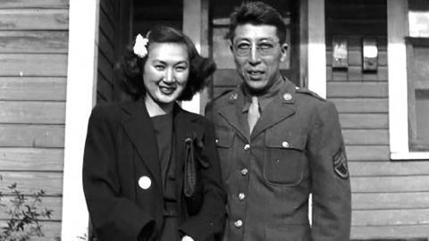 Bette and Kuichi Takei in front of their military housing in Hattiesburg, Mississippi.