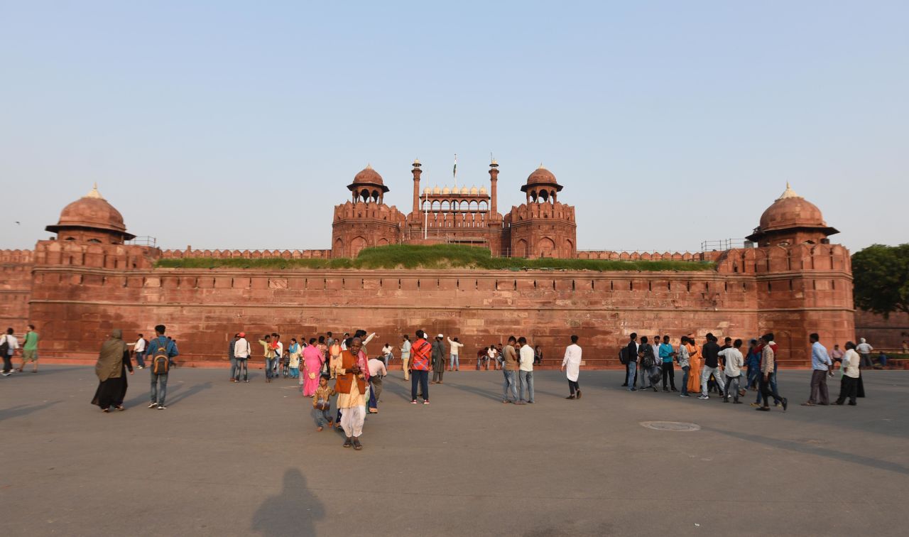 Tourists gather at the Red Fort in Delhi. The structure is a fascinating blend of influences -- Islamic, Persian, Timurid and Hindu -- and looms large in the history of Delhi.