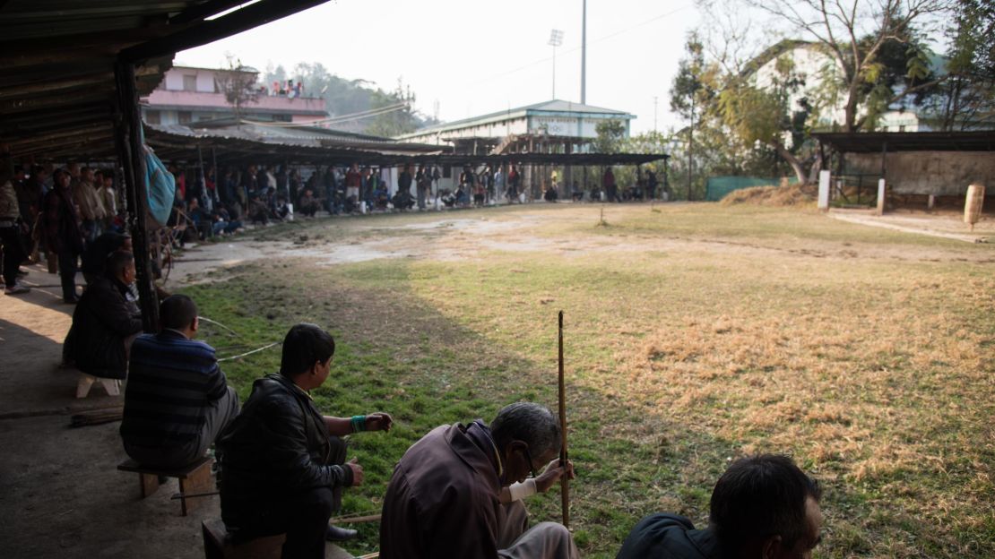 For 10 minutes, teer archers attempt to hit a single straw bale about 50 meters away.