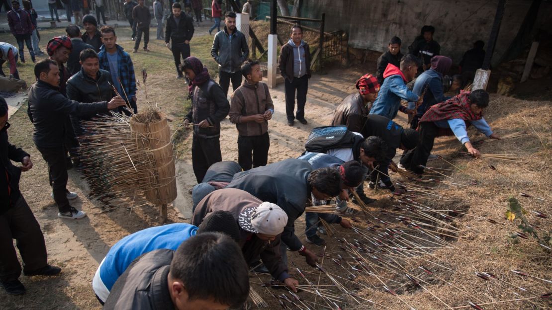 Archers reclaim their arrows at the teer shooting ground in Shillong, India.