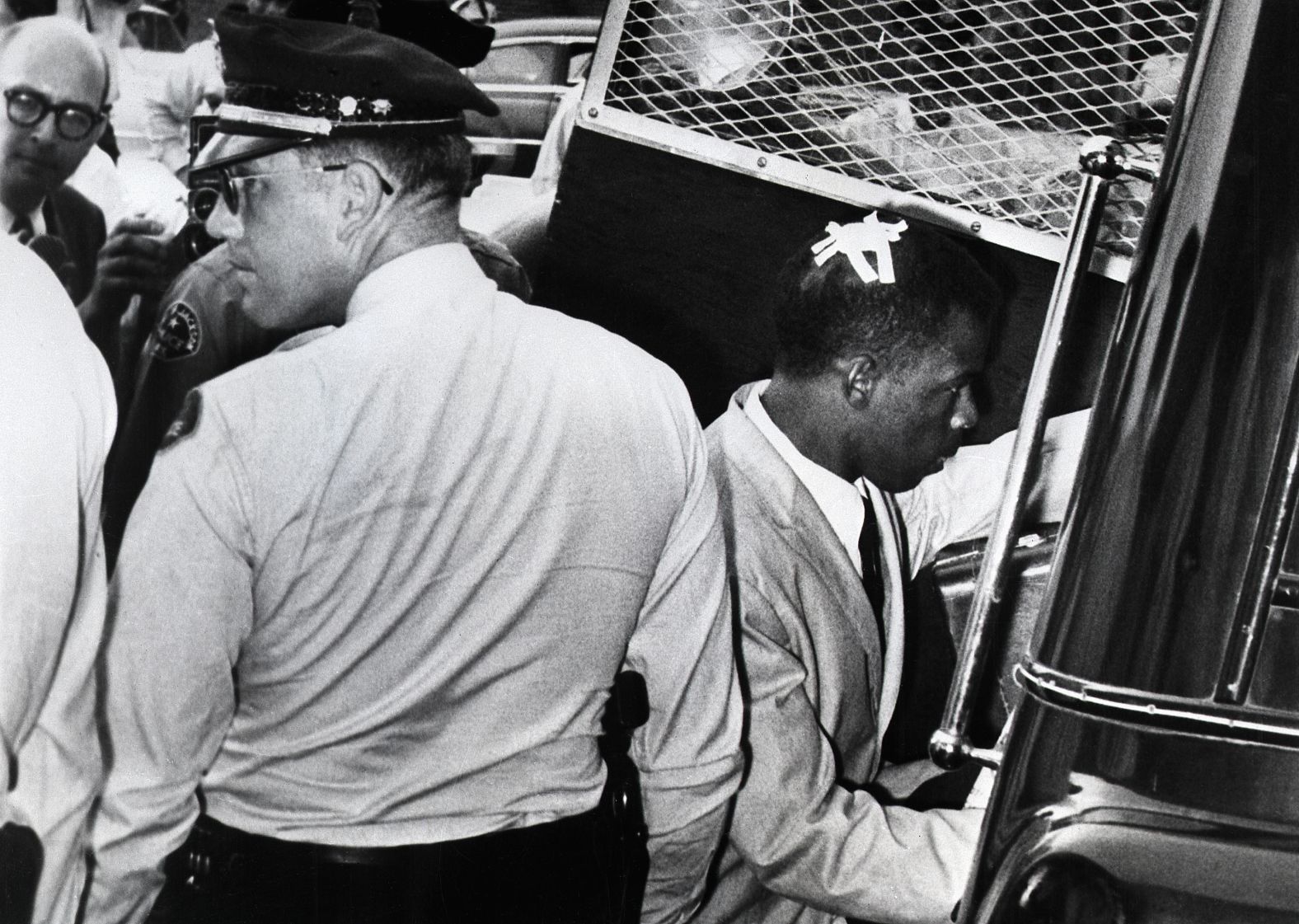 Lewis has tape on his head, marking the spot where he was struck during racial violence in Montgomery, Alabama, in May 1961. That month,<a href="index.php?page=&url=https%3A%2F%2Fwww.cnn.com%2F2017%2F02%2F15%2Fus%2Fgallery%2Ftbt-freedom-riders%2Findex.html" target="_blank"> the Freedom Ride movement</a> began with interstate buses driving into the Deep South to challenge segregation that persisted despite recent Supreme Court rulings. In some cities, the activists were arrested and brutally beaten.