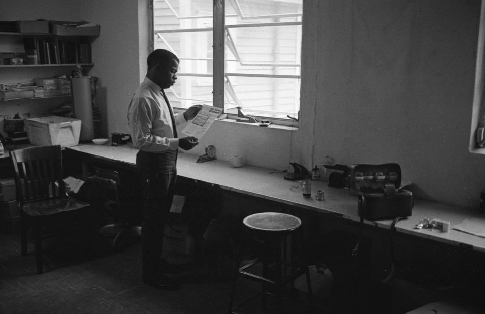 Lewis, as chairman of the Student Nonviolent Coordinating Committee, reads a document in a New York office in 1964. The document was "We Shall Overcome; the Authorized Record of the March on Washington Produced by the Council for United Civil Rights Leadership."