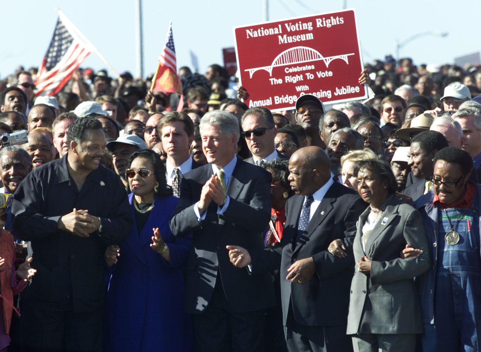 President Bill Clinton applauds in 2000 after leading marchers across Selma's Edmund Pettus Bridge on the 35th anniversary of "Bloody Sunday." With Clinton. from left, are the Rev. Jesse Jackson, Coretta Scott King and John and Lillian Lewis.