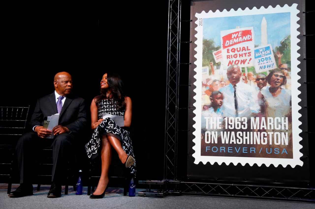 Lewis is joined by actress Gabrielle Union as the US Postal Service unveils a stamp commemorating the 50th anniversary of the March on Washington.