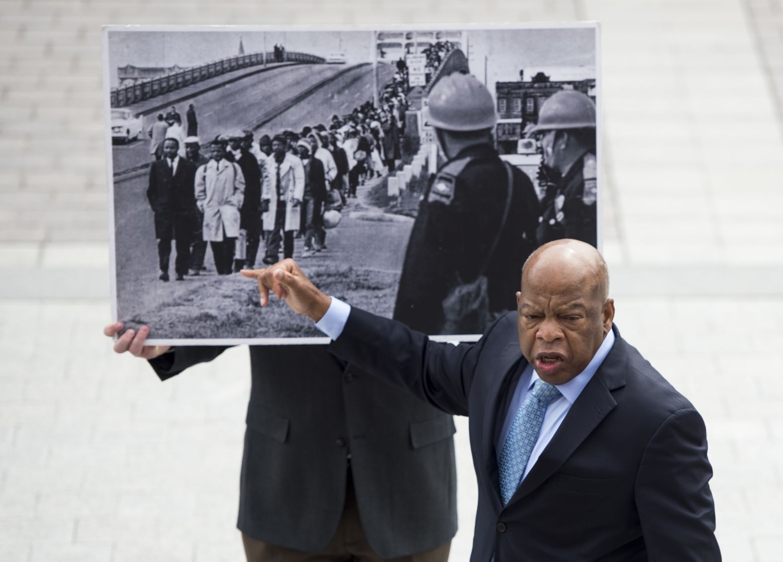 Lewis recounts his experience in Selma to a group of students who had gathered on the House steps in April 2015.