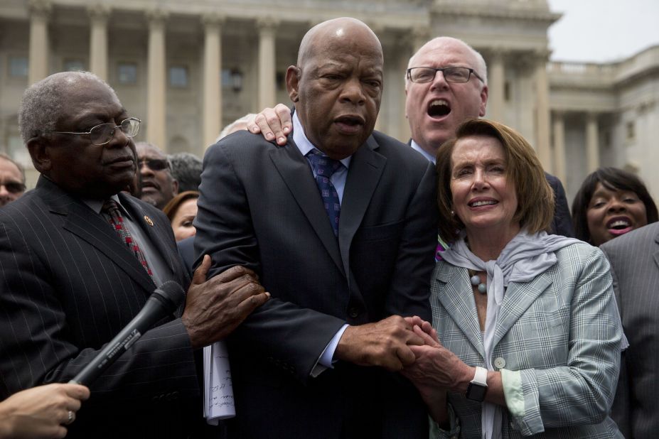After the sit-in, Lewis is joined by Pelosi and US Reps. Jim Clyburn and Joe Crowley as Democrats sing a song outside the US Capitol.