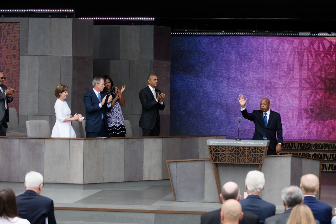 Lewis receives a standing ovation at the September 2016 opening of the National Museum of African American History and Culture. At left is President Barack Obama, first lady Michelle Obama, former President George W. Bush and former first lady Laura Bush.