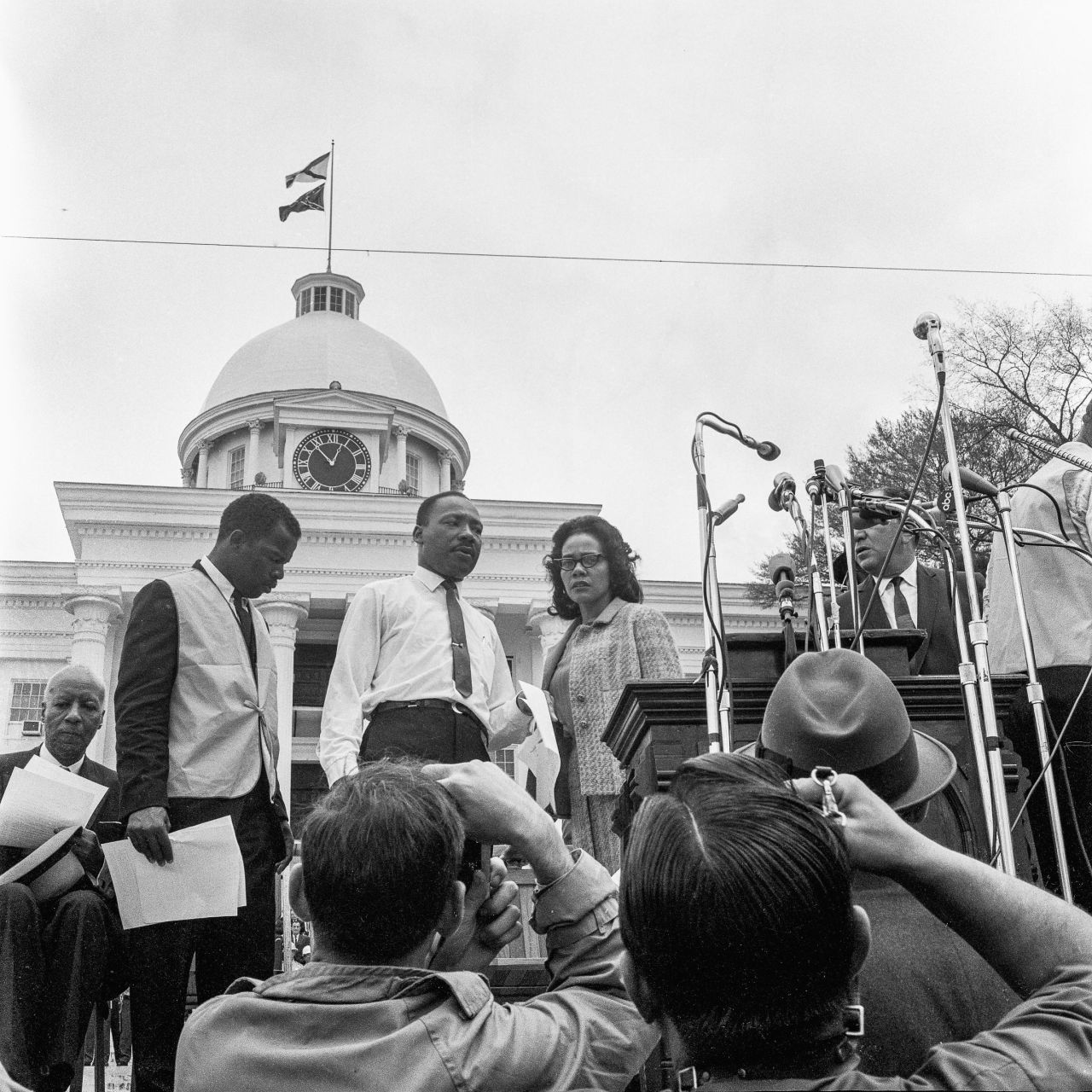 Lewis, in the vest, joins King and King's wife, Coretta Scott King, before a rally on the steps on the Alabama Capitol on March 25, 1965. A few months later, President Lyndon B. Johnson signed the Voting Rights Act, which ensured that everyone's right to vote would be protected and enforced.