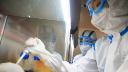 TOPSHOT - This photo taken on February 19, 2020 shows laboratory technicians testing samples of virus at a laboratory in Hengyang in China's central Henan province. - The death toll from the COVID-19 coronavirus epidemic jumped to 2,112 in China on February 20 after 108 more people died in Hubei province, the hard-hit epicentre of the outbreak. (Photo by STR / AFP) / China OUT (Photo by STR/AFP via Getty Images)
