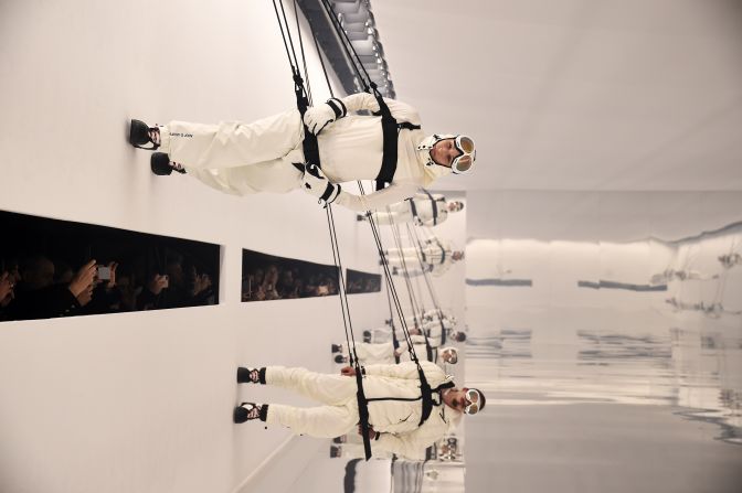 Models walk on a wall during a Moncler fashion show in Milan, Italy, on Wednesday, February 19. 