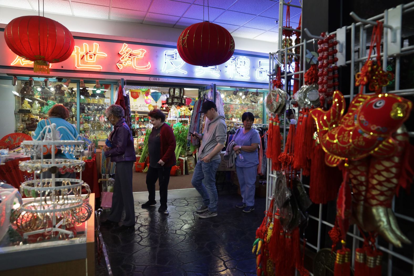 People wait in line for early voting at the Chinatown Plaza Mall in Las Vegas.