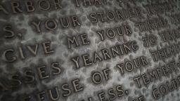 NEW YORK, NY - AUGUST 14: Words from 'The New Colossus' poem by Emma Lazarus are engraved on the Emma Lazarus Memorial Plaque in Battery Park on August 14, 2019 in New York City. On Tuesday, acting Director of the Citizenship and Immigration Services Ken Cuccinelli reworked the words of the Emma Lazarus poem The New Colossus as he defended the Trump administrations immigration policies. The poem appears on a plaque inside The Statue of Liberty. The 1883 poem by Lazarus is often cited as an inspiration statement about America's attitude toward immigrants. (Photo by Drew Angerer/Getty Images)