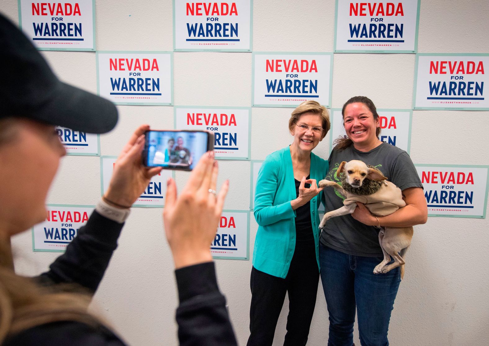 Warren meets Bitcoin the dog during a visit to her field office in Las Vegas on Thursday.