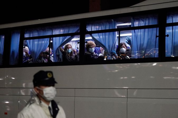 Americans wave from a bus Monday, February 17, as they leave the Diamond Princess cruise ship that had been docked in Yokohama, Japan. <a href="https://www.cnn.com/2020/02/17/health/diamond-princess-american-evacuees-flight/index.html" target="_blank">They were being repatriated</a> after the ship was stuck in quarantine.