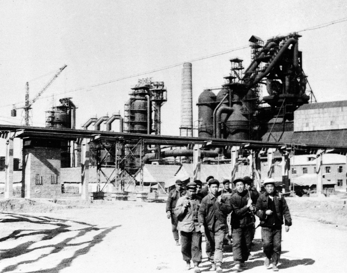 A group of laborers in front of the first blast furnace of the new steel-producing center being built in Wuhan, China, in 1959.  