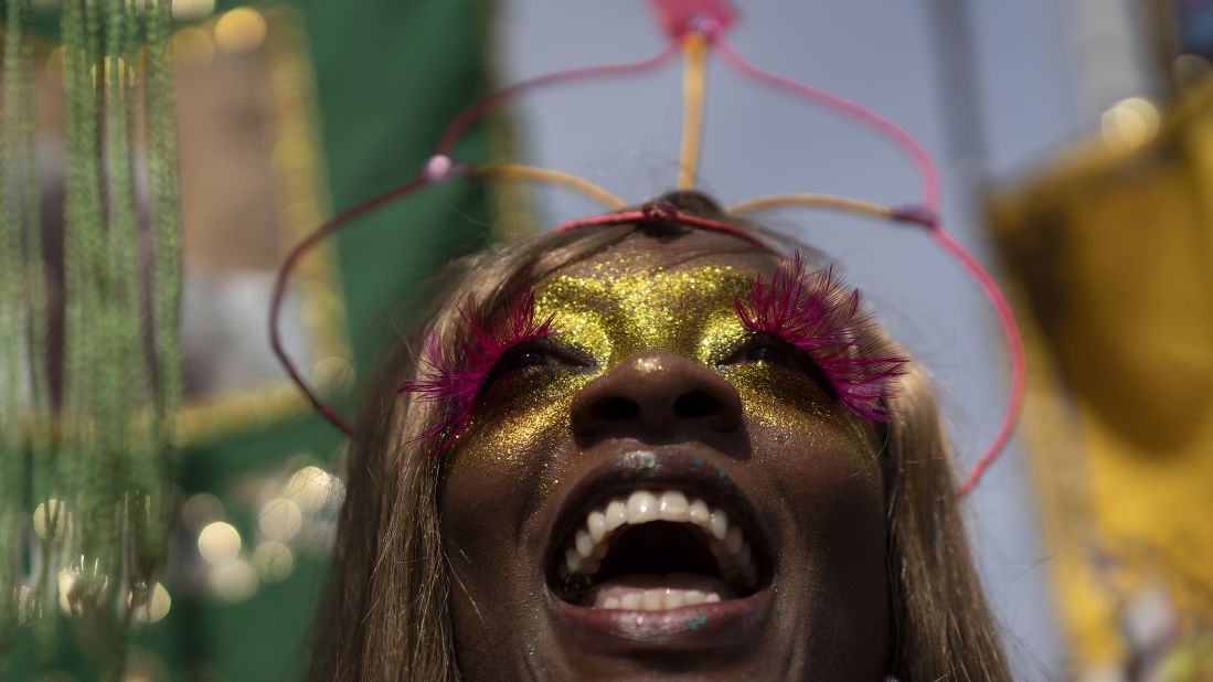 <strong>Rio de Janeiro, Brazil: </strong>A reveler in a costume enjoys the "Cordao do Boitata" street party on Sunday, February 16.