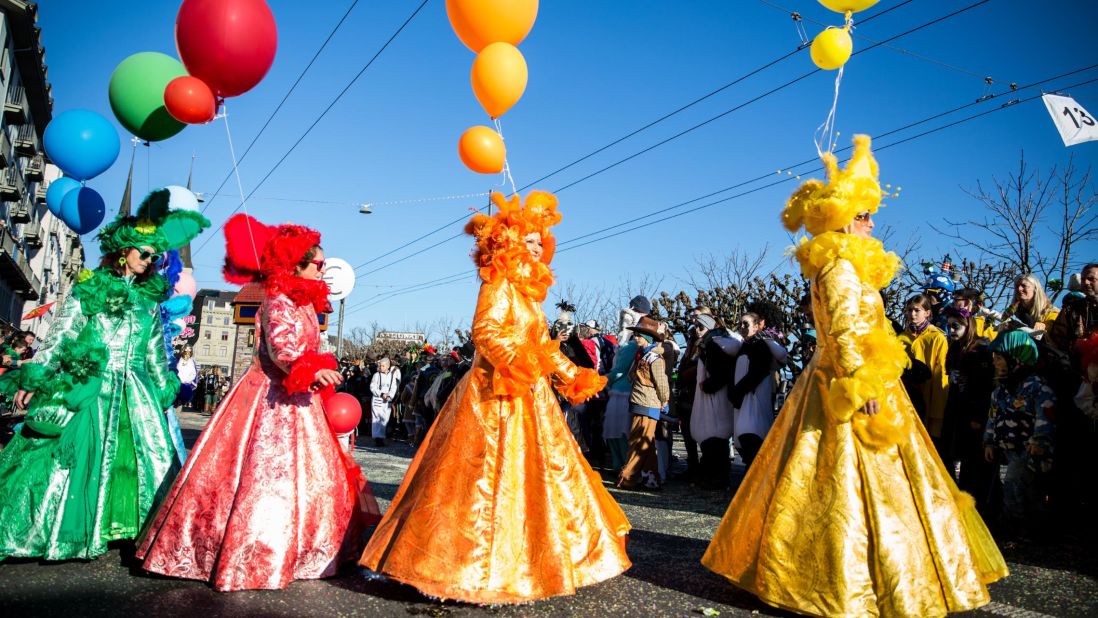 <strong>Lucerne, Switzerland:</strong> Women in colorful costumes perform during the Carnival Parade (Fritschi Umzug) on Thursday, February 20.