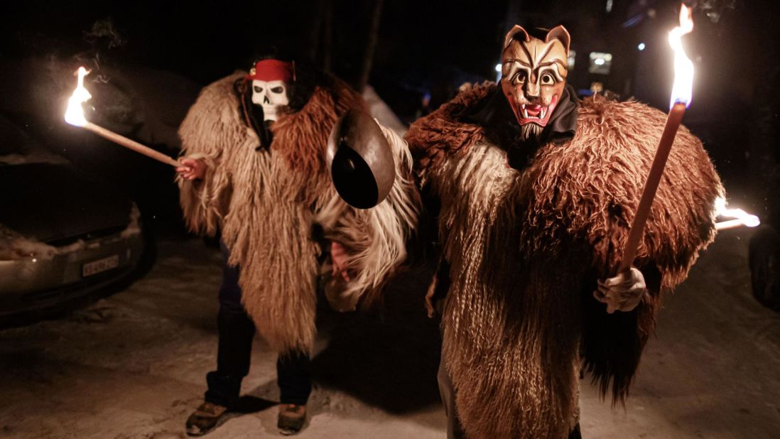 <strong>Arolla, Switzerland:</strong> Men dressed in traditional "peluche" ("plush" in French) parade through the forest and streets of the Alpine village on Wednesday, February 19. They wear animal furs, beastly masks and ring their bells to scare away the bad spirits of winter.