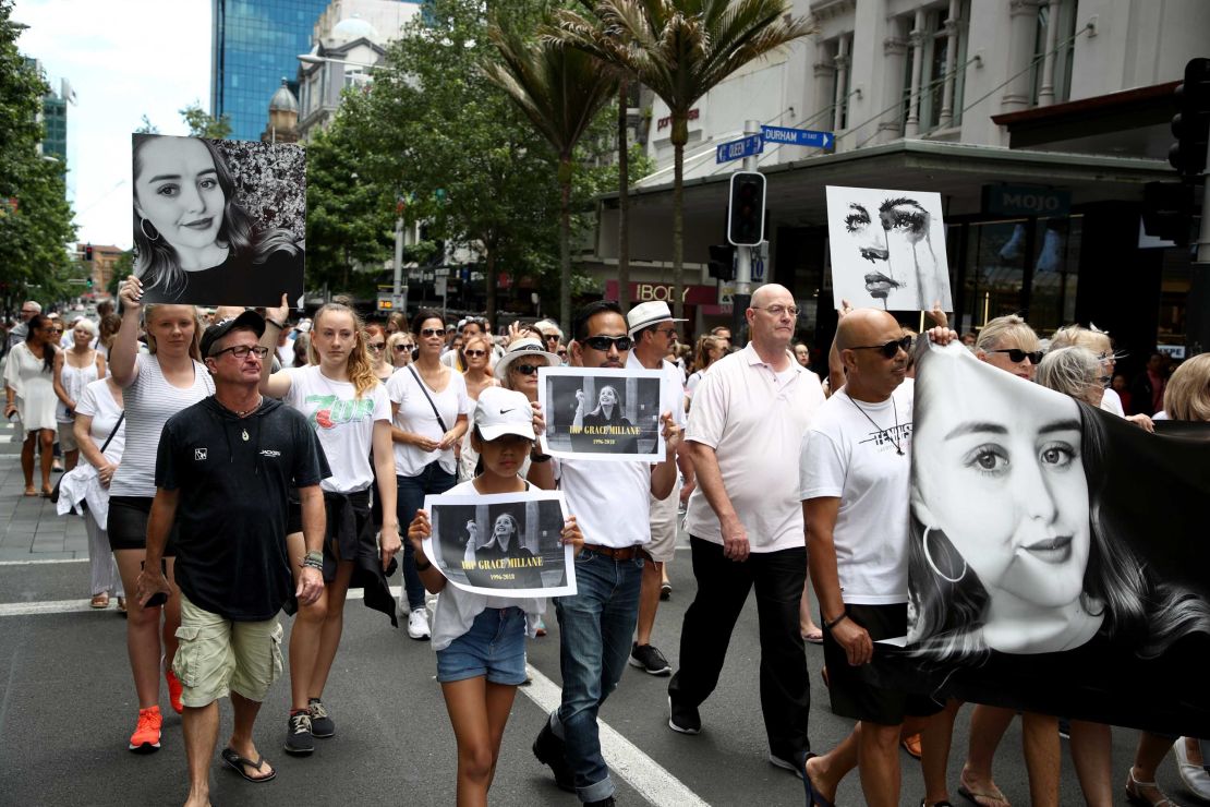 People walk in a silent march to remember Grace Millane in Auckland, New Zealand, in December 2018.