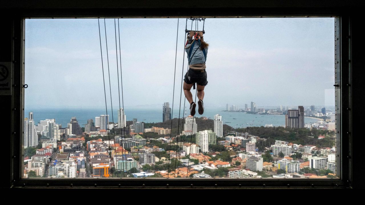 <strong>Pattaya, Thailand: </strong>A brave soul takes on the zipline which runs from the 55th floor of the observation tower in Park Beach Resort. 