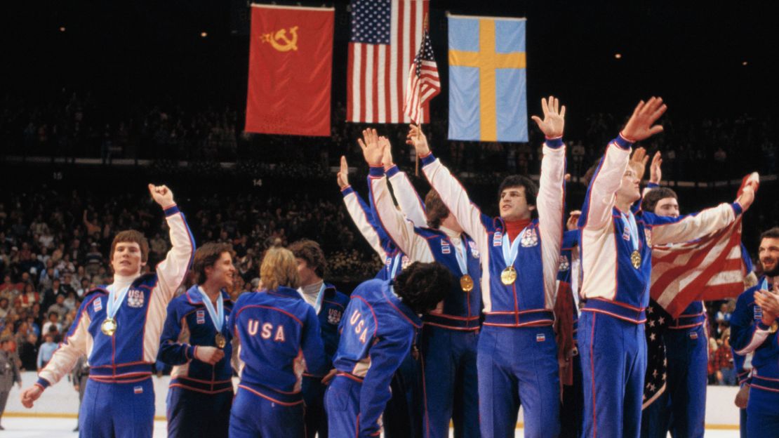 The US Olympic Team crowds onto the center podium with fingers pointed skyward designating their "Number One" status at Olympic awards ceremonies on February 24, 1980.