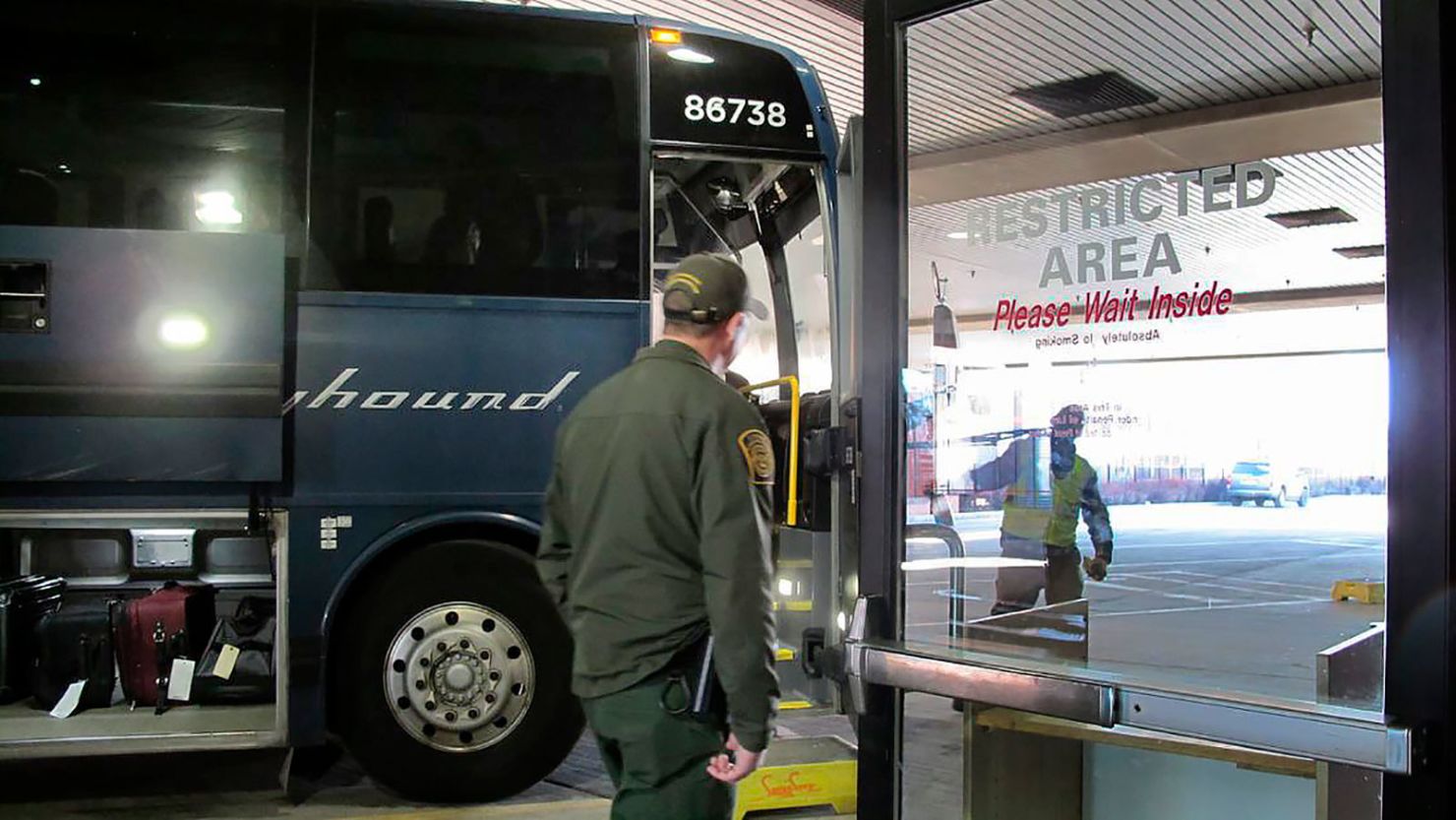 Agents for Customs and Border Protection board a Greyhound bus headed for Portland, Oregon, at the Spokane Intermodal Center on February 13, 2020. 