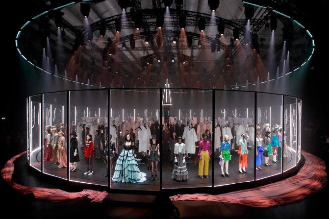 Alessandro Michele turned the format of a show on its head by having the entire design team dressing models behind a clear revolving carousel 